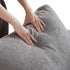 Hands gently pressing on the backrest of a HavenlyCloud® Couch Corner in Gray, crafted with performance fabric.